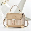 Detail of beige textured shoulder bag showing T-shaped gold clasp and leather trim - Khaki