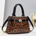 Leopard print crossbody handbag with black patent leather handle and gold twist lock - Khaki/Earth Yellow