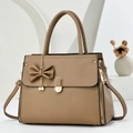 Detail of khaki lychee grain leather handbag with pearl chain and bow decoration - Dark Khaki