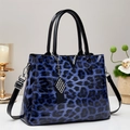 Blue leopard print tote bag in glossy patent leather with silver V-shaped hardware detail - Blue