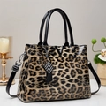 Classic leopard print handbag with glossy finish, dual handles and silver V-shaped hardware - Khaki