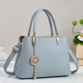 Light blue lychee grain leather tote bag with gold hardware and hollow metal pendant - Blue
