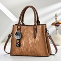 Retro brown crossbody handbag with metallic texture, plush pompom, and LOVE ribbon strap - Earthy Yellow