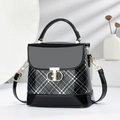 Chic black and white checkered crossbody bag with gold T-clasp and leather handle - Black