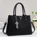 Elegant black knit handbag with metal V logo, leather handles and adjustable shoulder strap - Black