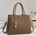 Detail of coffee brown handbag with V-shaped metal hardware and woven texture leather - Khaki