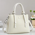 Close-up of cream crossbody bag with woven texture, dual handles and silver hardware - Off-white
