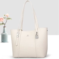 Detail of creamy white tote bag featuring lychee grain texture and metal checkerboard pendant - Off White