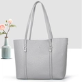 Detail of grey lychee grain leather tote bag with silver buckle and dual shoulder straps - Gray