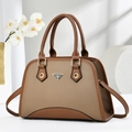 Vintage brown leather crossbody handbag with dual handles and elegant metal logo - Brown