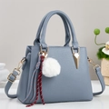 Litchi pattern satchel bag in fog blue with gold metal and plush ball accessory - Blue