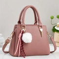 Chic lotus pink pebbled leather handbag with gold hardware and white faux fur pompom charm - Pink