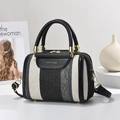 Stylish black and white striped canvas tote bag with gold hardware and leather details - Black