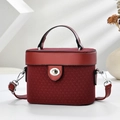 Elegant wine red box handbag with V-shaped texture and silver twist lock on geometric base - Wine Red