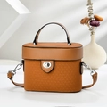 Detail of camel vintage box bag showing embossed woven texture and silver turn-lock - Khaki/Earth Yellow