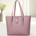 Detail of lavender lychee leather tote bag with silver metal hardware and buckle - Purple