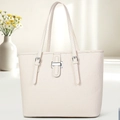 Detail of off-white lychee grain tote bag with elegant metal buckle and slim shoulder straps - Off-white