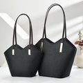 Litchi textured black tote bag set with V-shaped cut and gold buckle on a minimalist stand - Large and Small 2-Piece Set / Black