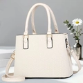 Detail of beige crossbody bag showing refined woven texture and gold-tone hardware - Khaki