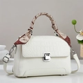Detail of white leather handbag with croc-embossed flap and silk scarf wrapped handle - White