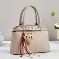 Elegant beige leather handbag with pebble texture and metallic twist lock clasp for women - Khaki