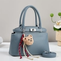 Fog blue lychee leather tote bag with silver twist lock and bear charm - Blue