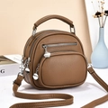 Brown multi-layer crossbody bag detail showing litchi grain texture and silver hardware - Brown