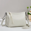 Detail of creamy white pebble grain leather bag with silver metal hardware and knot puller - Off-white