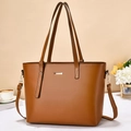 Detail of tan brown PU leather tote bag featuring golden hardware and adjustable strap - Khaki/Earth Yellow
