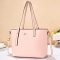 Elegant pink PU leather tote bag with gold metal plate and slim handles in a lifestyle setting - Pink