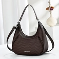 Close-up of brown woven crescent handbag showing leather handles and silver VB metal logo - Coffee