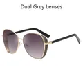 Lunettes de soleil dorées pour femmes avec verres dégradés gris et branches noires chic - Doubles Verres Gris