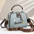Light blue faux leather handbag with wide shoulder strap and brown trim for women - Blue