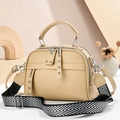 Minimalist beige crossbody bag with textured leather, wide strap, and silver rivets - Khaki