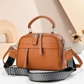 Brown litchi leather crossbody bag with wide V-pattern strap and silver rivets - Earthy Yellow