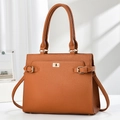 Classic caramel brown pebbled leather satchel with golden clasp and window shadow lighting - Khaki/Earth Yellow