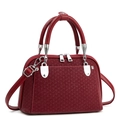Fashionable dark red shell-shaped handbag with woven pattern and silver hardware on white background - Wine Red