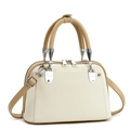 Detailed view of beige and khaki shell bag with silver hardware and smooth texture - Beige Apricot