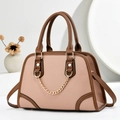 Elegant beige pebbled leather handbag with dark brown handles and golden chain detail - Pink