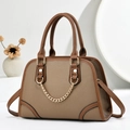 Brown leather crossbody handbag with gold chain detail and adjustable shoulder strap - Brown