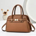 Classic caramel leather handbag with golden bow detail and dual-purpose shoulder straps - Khaki/Earth Yellow