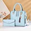 Light blue faux crocodile skin tote bag and matching clutch set with a red tassel charm - Light Blue