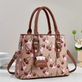 Chic beige tote bag with cherry print, brown leather handles and a mini bag charm - Khaki