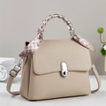Elegant beige lychee leather trapezoid handbag with decorative silk scarf on handle - Light Khaki