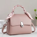 Pink lychee grain leather crossbody bag with scarf-wrapped handle and silver twist lock - Pink