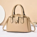 Close-up of litchi textured beige handbag with golden equestrian horsebit metal buckle - Khaki