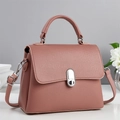 Elegant dusty pink crossbody bag with silver lock and pebble grain leather finish - Pink