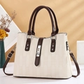 Detail of cream checkered handbag with brown leather strap and silver metal clasp - Off-white Bamboo Grain