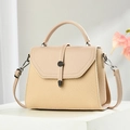 Detail view of beige crossbody bag showing contrasting woven texture and metal buckle accents - Khaki