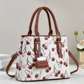 White leather cherry print Boston bag with brown handles and a mini charm accessory - Off White